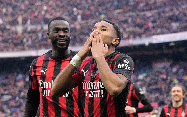 Nkunku double sends Milan top after Verona win