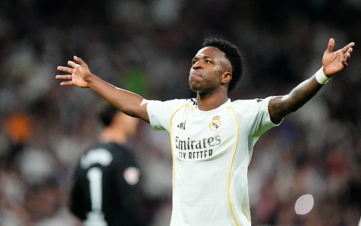 Vinicius double fires 10-Man Real past Atletico in derby to keep title hopes alive